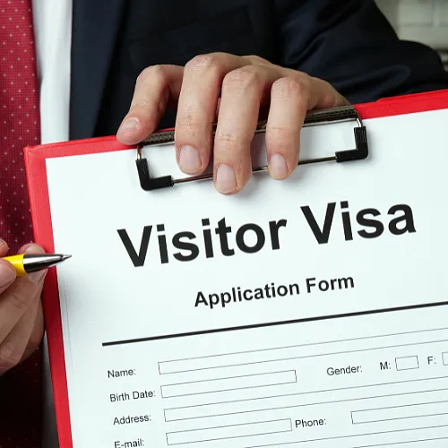 A close-up view of a visa application form, featuring fields for personal information and travel details.